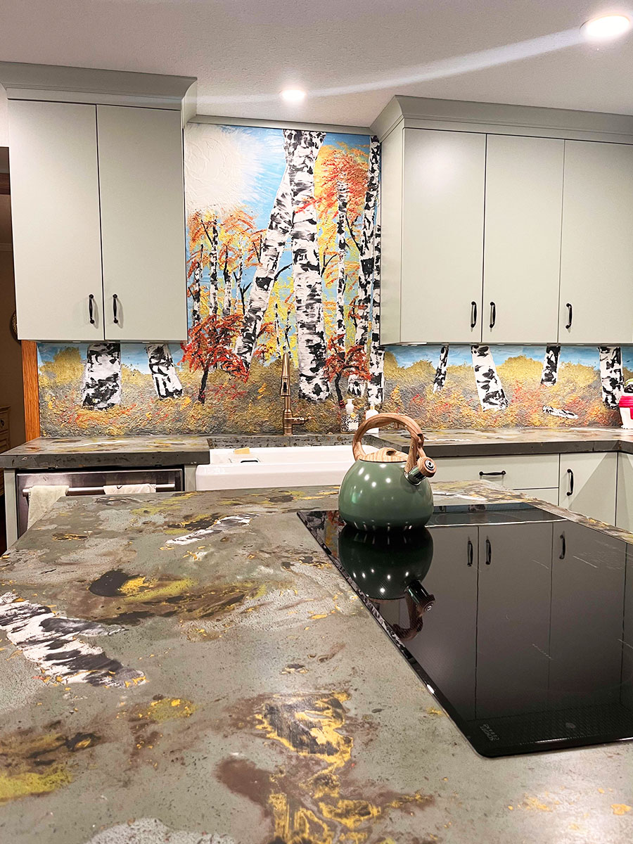 A custom concrete panel with a birch motif
