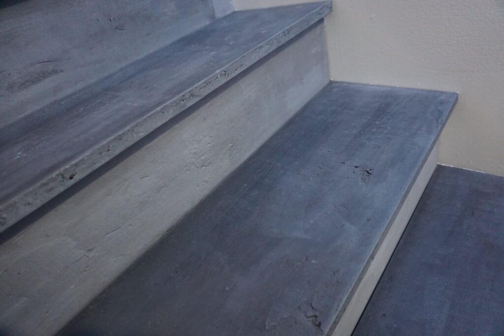 White concrete stair railing with LED lights