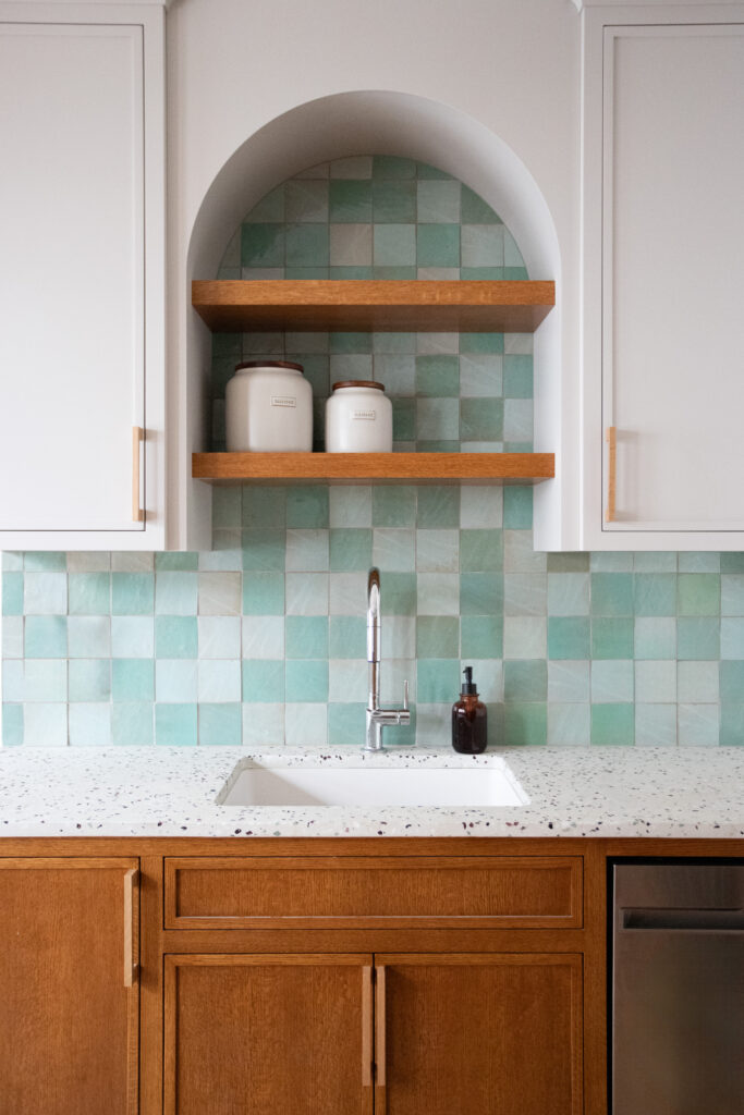 Arched cabinets with concrete terrazzo countertops