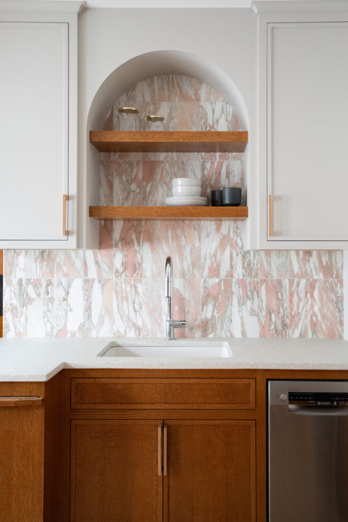 Arched cabinets with concrete terrazzo countertops