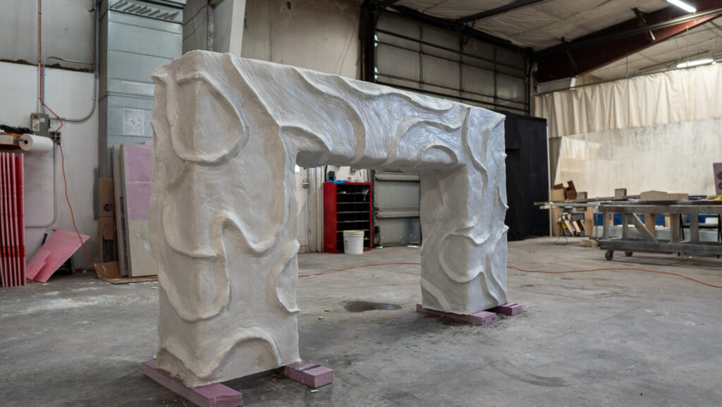 White concrete bougie fireplace surround