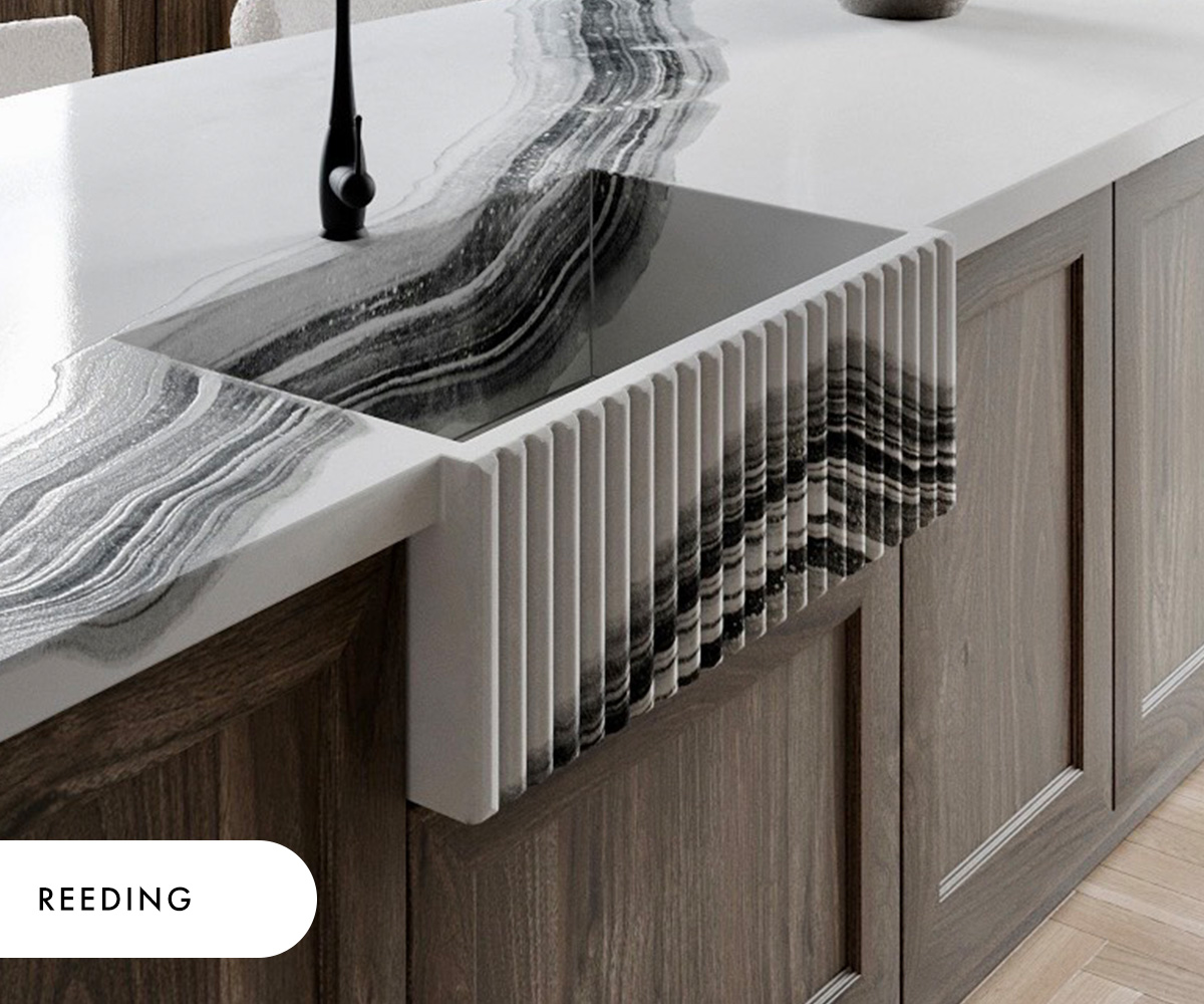 A reeded concrete farmhouse sink in the Gratitude pattern