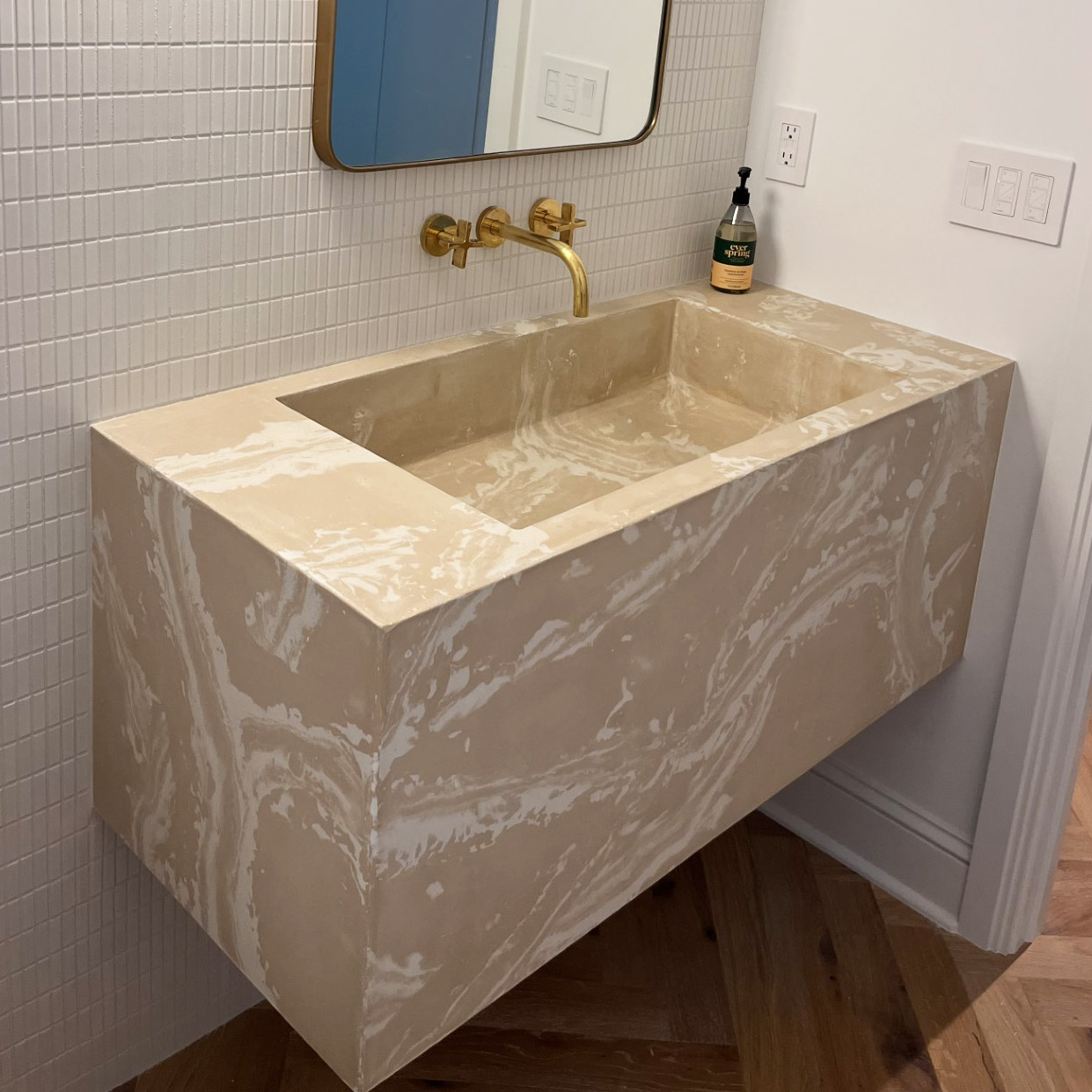 A custom concrete sink with a target design