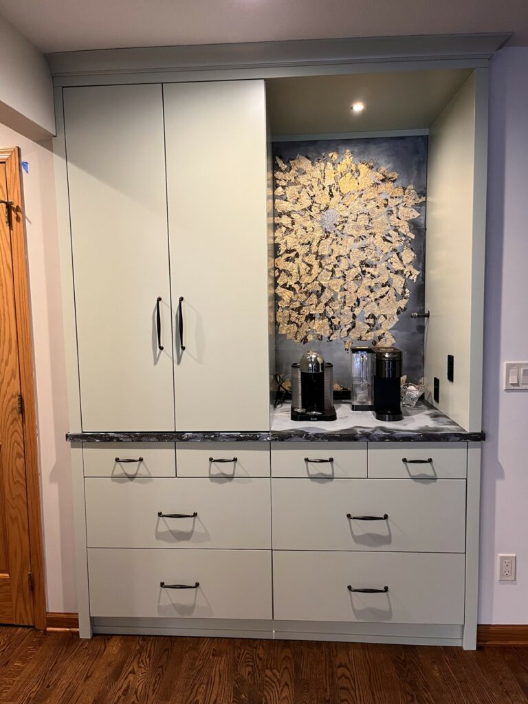 Coffee bar with concrete backsplash and concrete countertops in a sun pattern