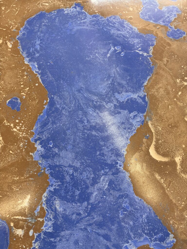 Closer view of concrete countertops that look like a lake