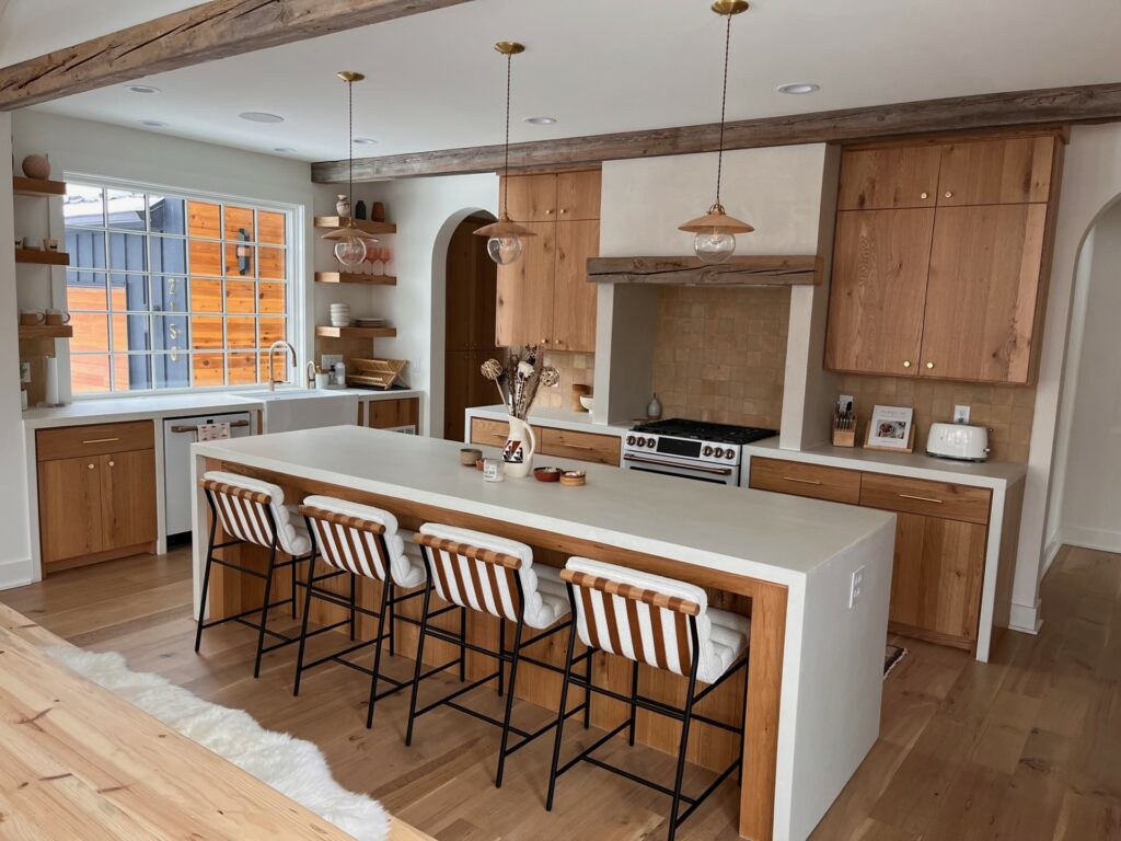 White concrete double waterfall kitchen island