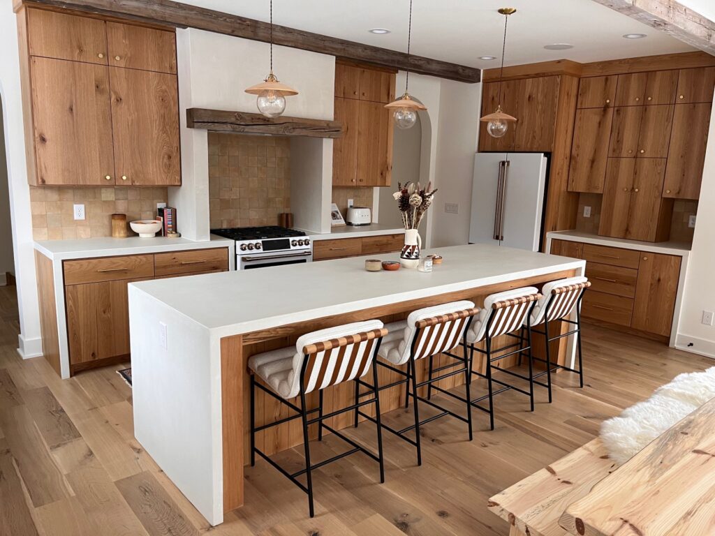 White concrete kitchen island, double waterfall kitchen island