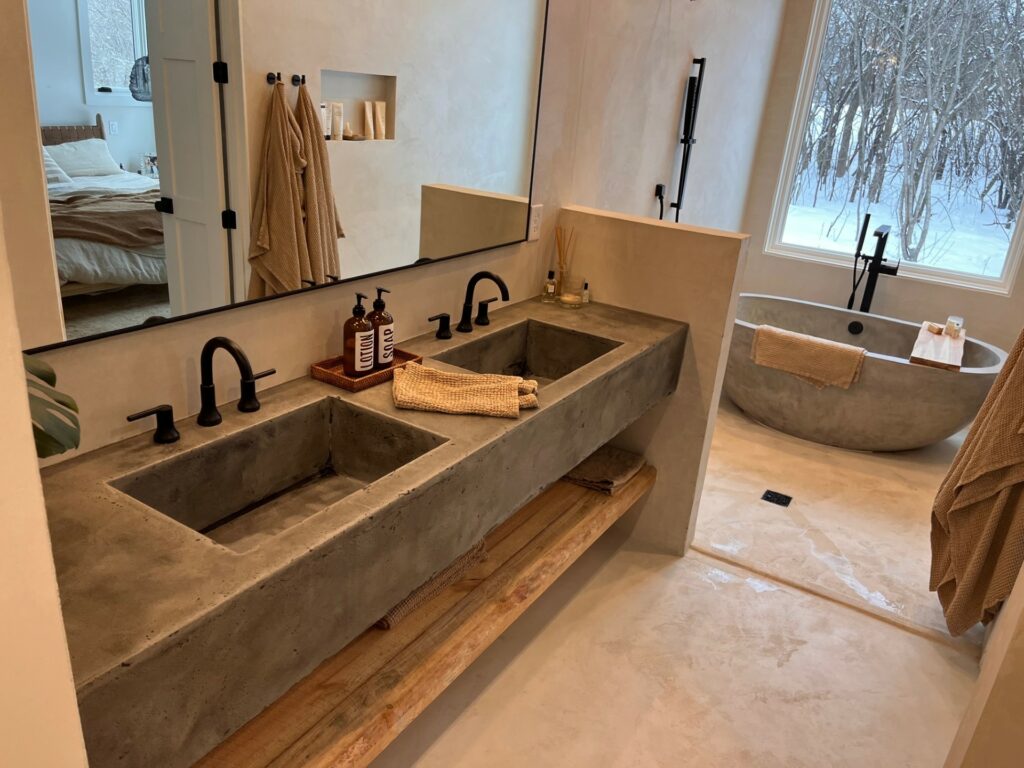 Floating concrete vanity with trough sinks