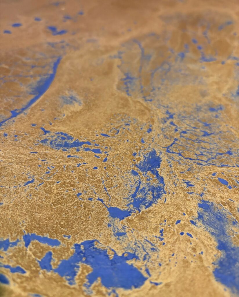 Close up view of concrete countertops with blue in them