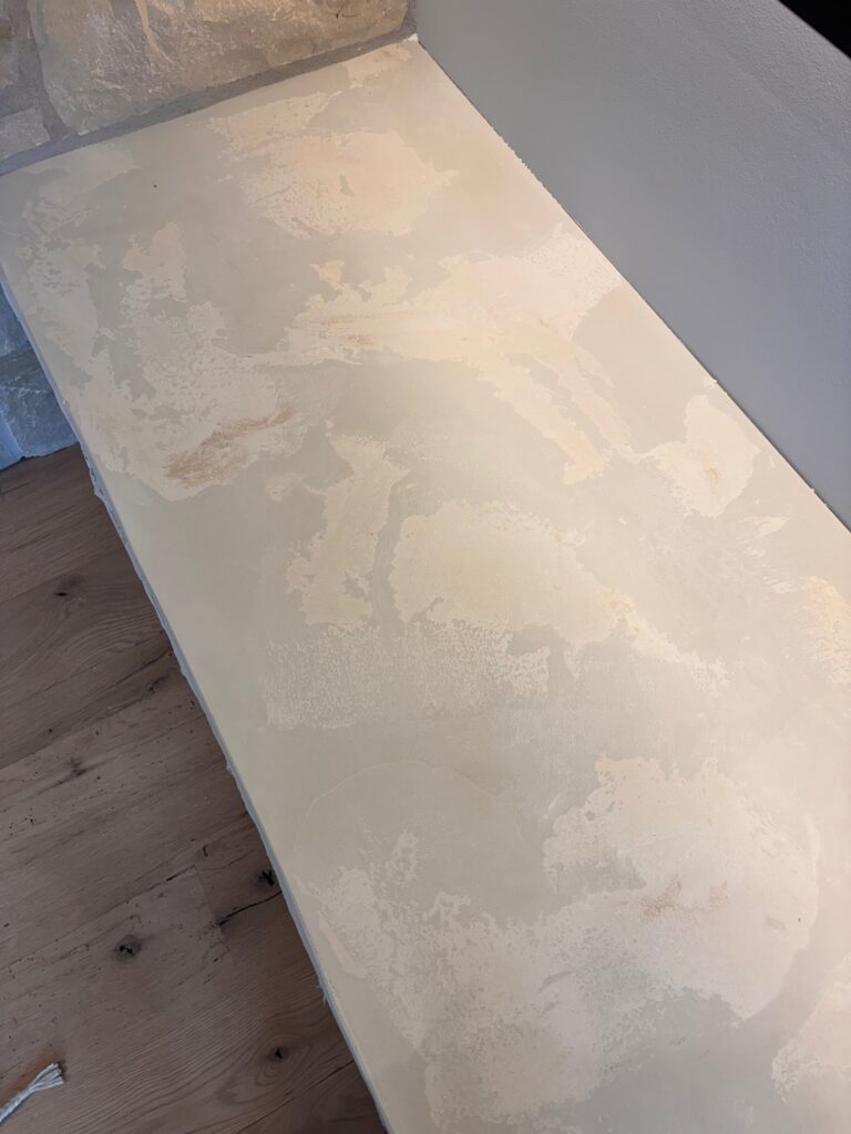 Textured concrete fireplace surround