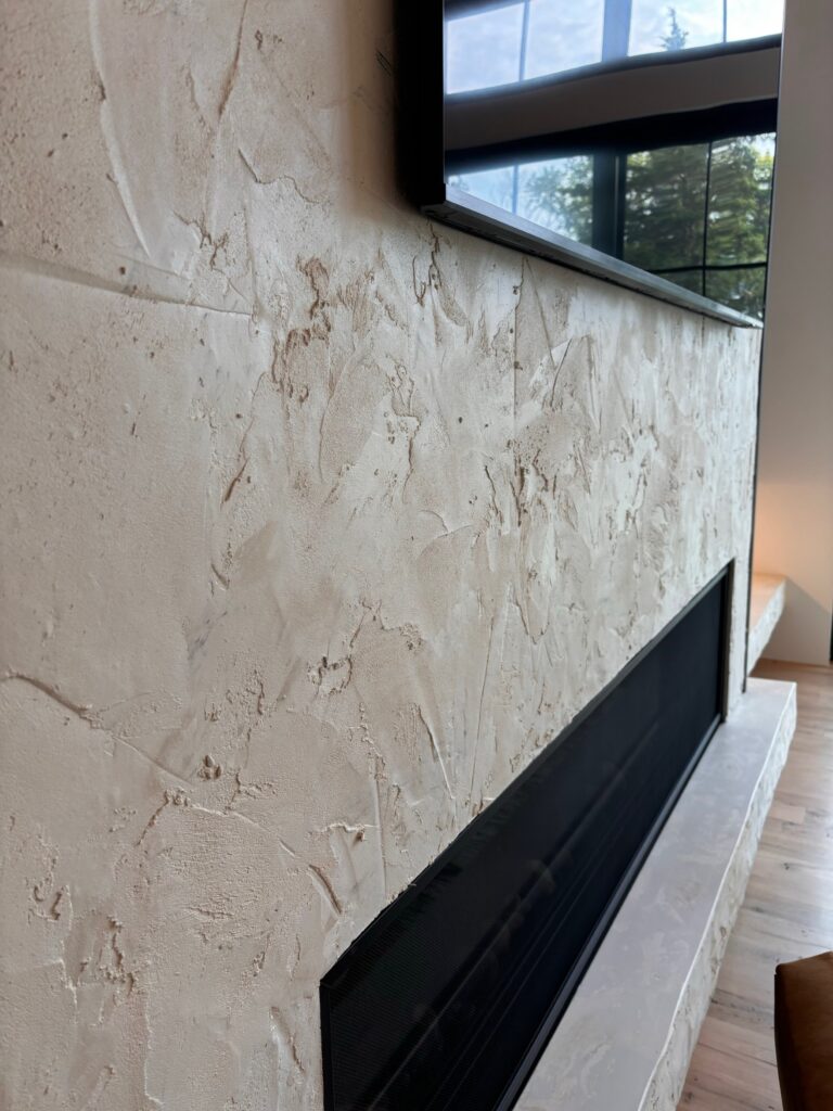 Textured concrete fireplace surround
