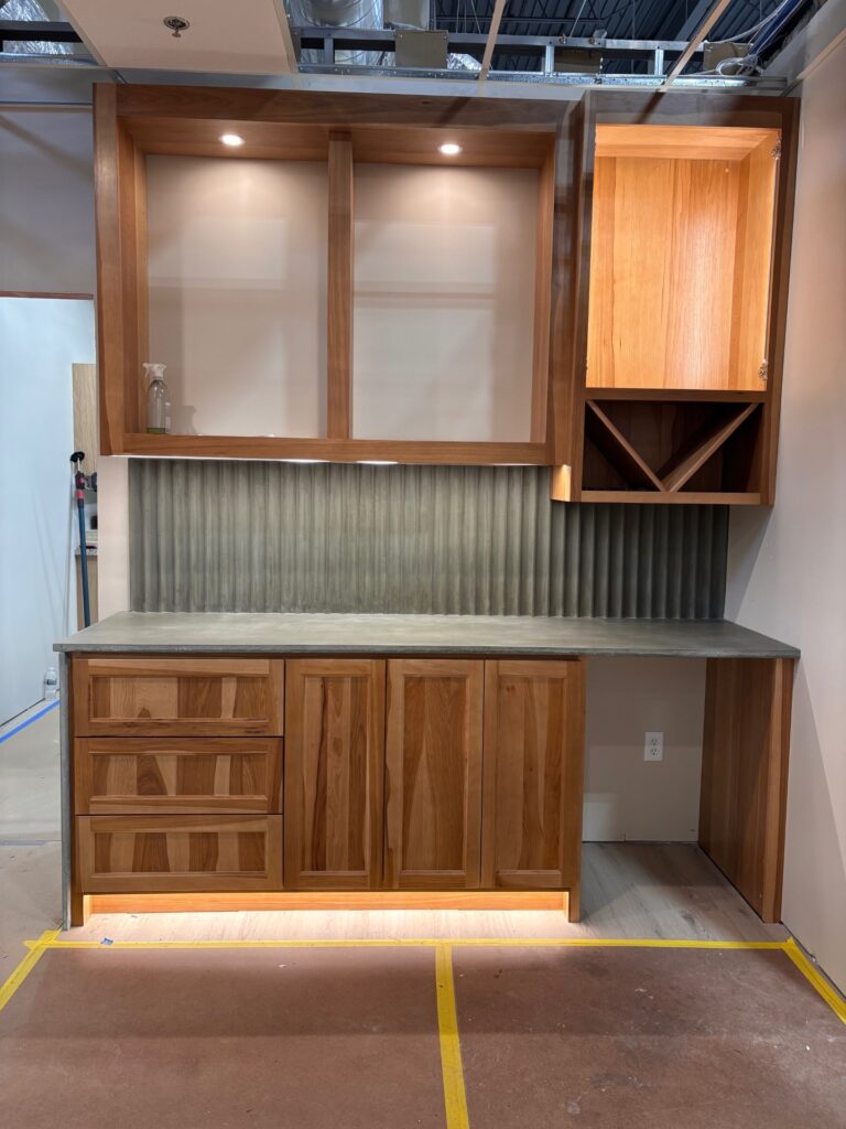 Slate green concrete countertops with fluted backsplash