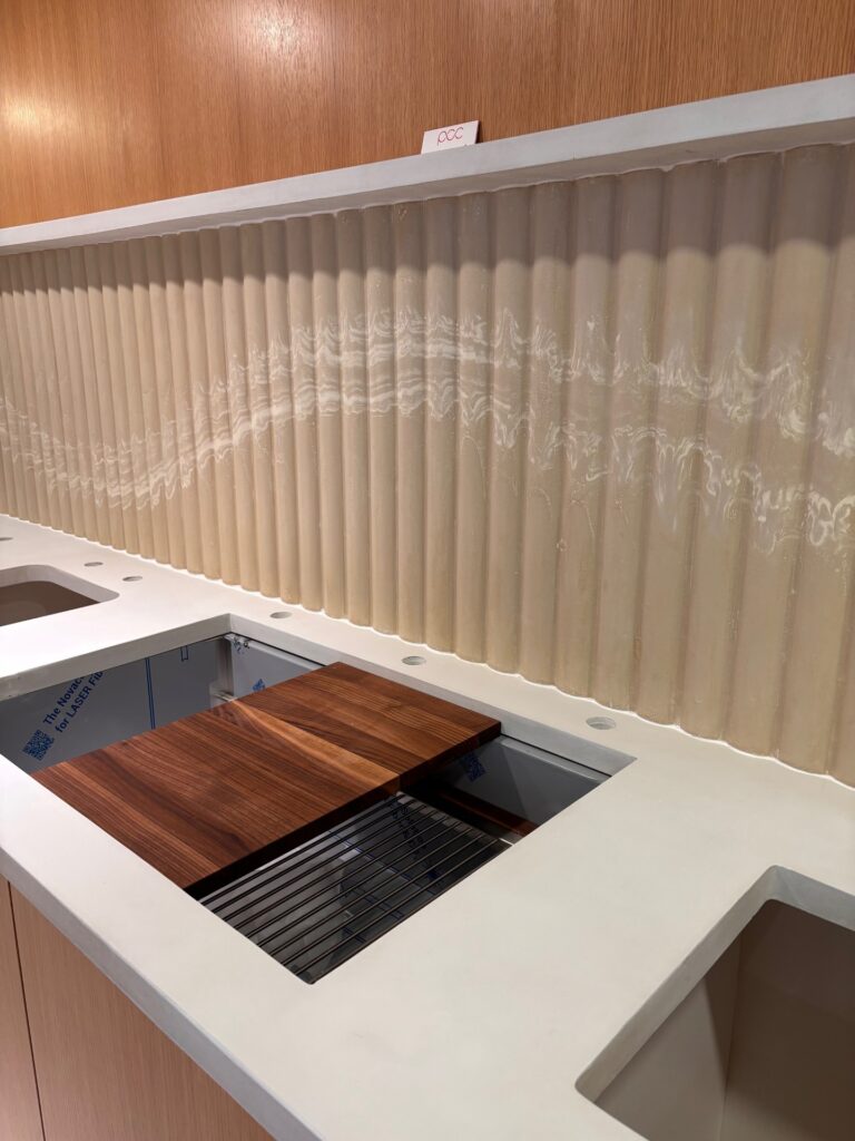 Reeded concrete showroom kitchen