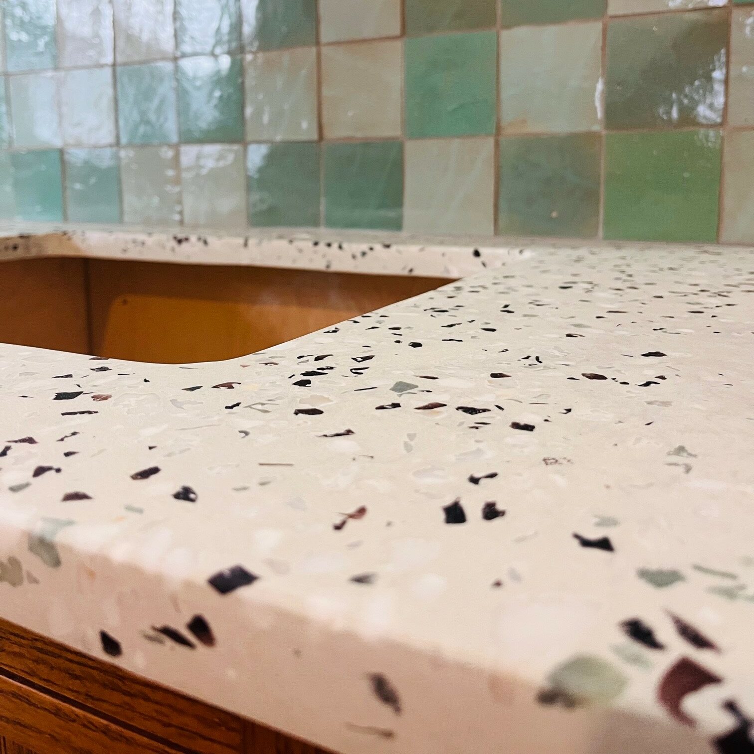 Terrazzo concrete countertops that are green and purple