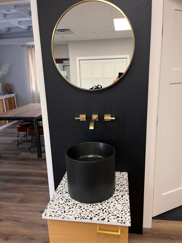 Concrete terrazzo vanity with black concrete sink