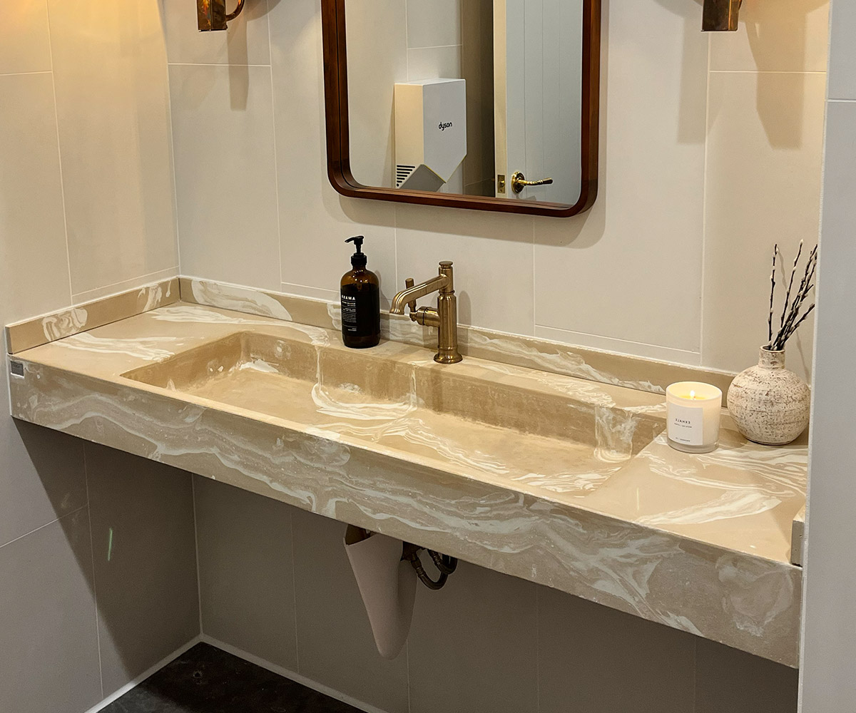 A concrete bathroom vanity in the Gratitude pattern